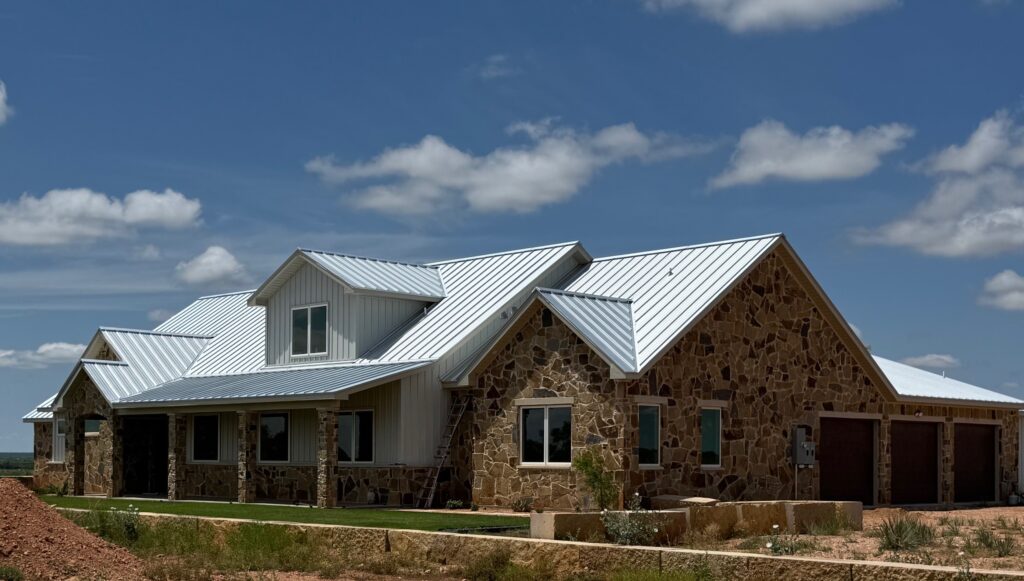 installation of new standing seam metal roof on a home